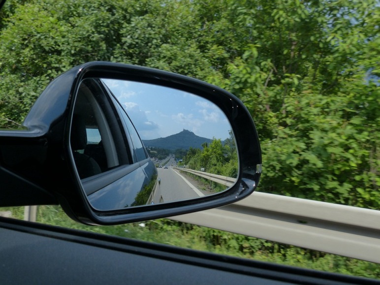 Reflection in the rear view mirror of the car.
